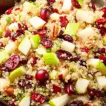 Cranberry Apple Quinoa Salad with green apples, cranberries, and quinoa in a wooden bowl