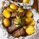 Garlic Butter Steak and Potato Foil Packets with baby potatoes and herbs