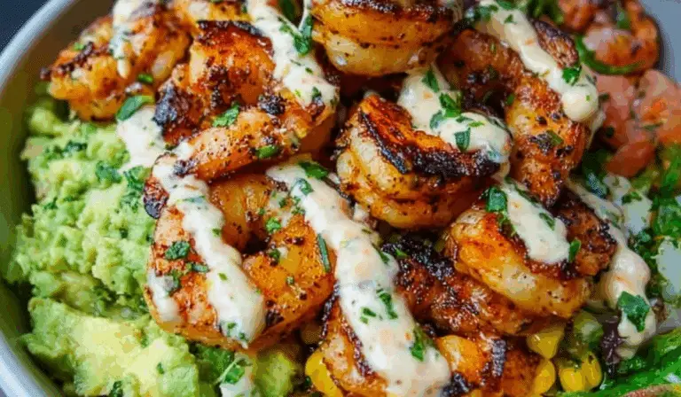 Grilled shrimp bowl with avocado, corn salsa, and creamy cilantro lime sauce