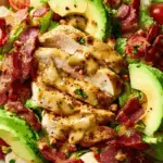 Honey Mustard Chicken Salad with Bacon and Avocado topped with creamy dressing