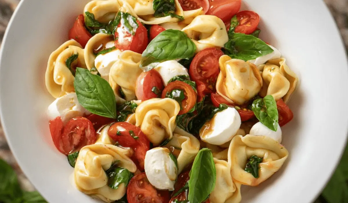 Tortellini Caprese Salad with cherry tomatoes, mozzarella, and basil