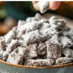 Puppy Chow Recipe aka Muddy Buddies served in a festive bowl on a holiday table