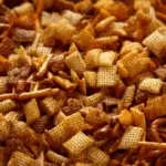 Homemade Chex Mix (Oven or Slow Cooker) in rustic bowl