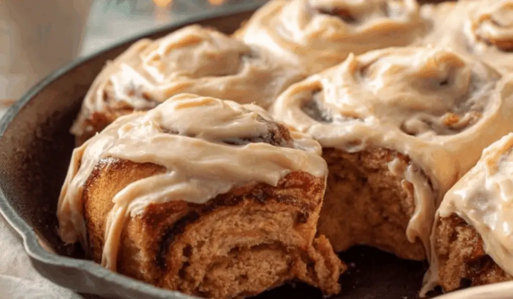 Gingerbread Cinnamon Rolls fresh baked in holiday setting