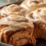 Gingerbread Cinnamon Rolls fresh baked in holiday setting