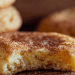 Soft Snickerdoodle Cookies stacked on rustic table