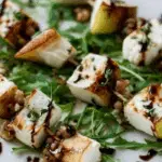 Pear and Brie Cheese Salad Skewers on rustic board