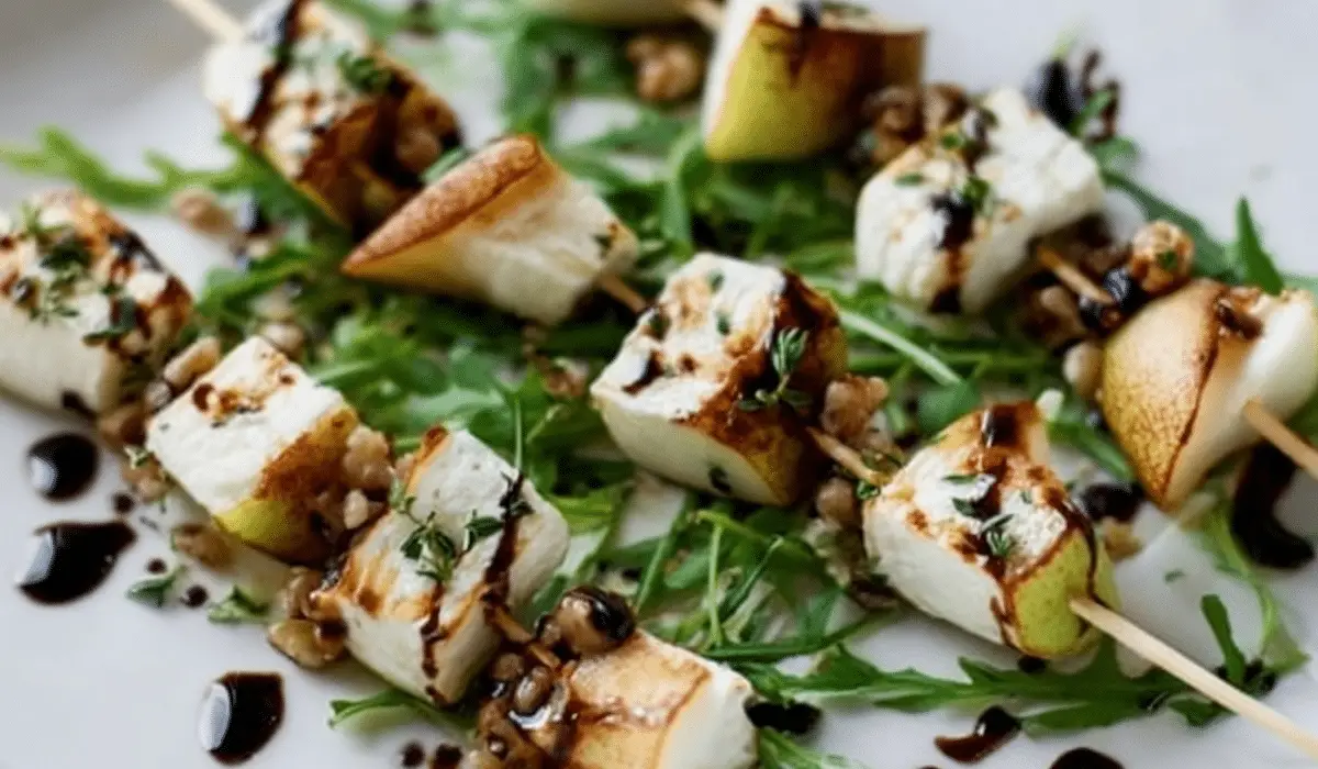 Pear and Brie Cheese Salad Skewers on rustic board