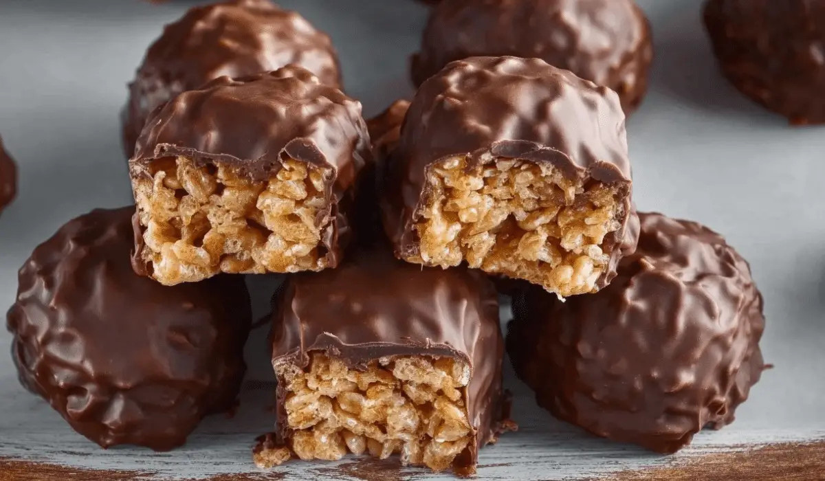 Crispy Rice Peanut Butter Treats stacked on plate