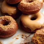 Baked Pumpkin Donuts with fall leaves and cinnamon