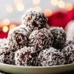 No-Bake Chocolate Coconut Snowballs on festive plate