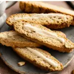 Sweet Vanilla Bean Biscotti with coffee on rustic table
