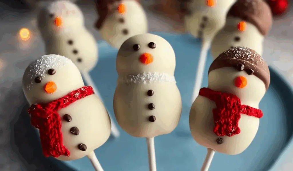 No Bake Chocolate Snowman Cake Pops decorated for Christmas