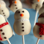 No Bake Chocolate Snowman Cake Pops decorated for Christmas