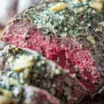 Garlic Butter Beef Tenderloin sliced with herb butter