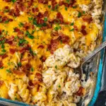 Delicious Crack Chicken Pasta Bake topped with melted cheese and parsley, served in a baking dish